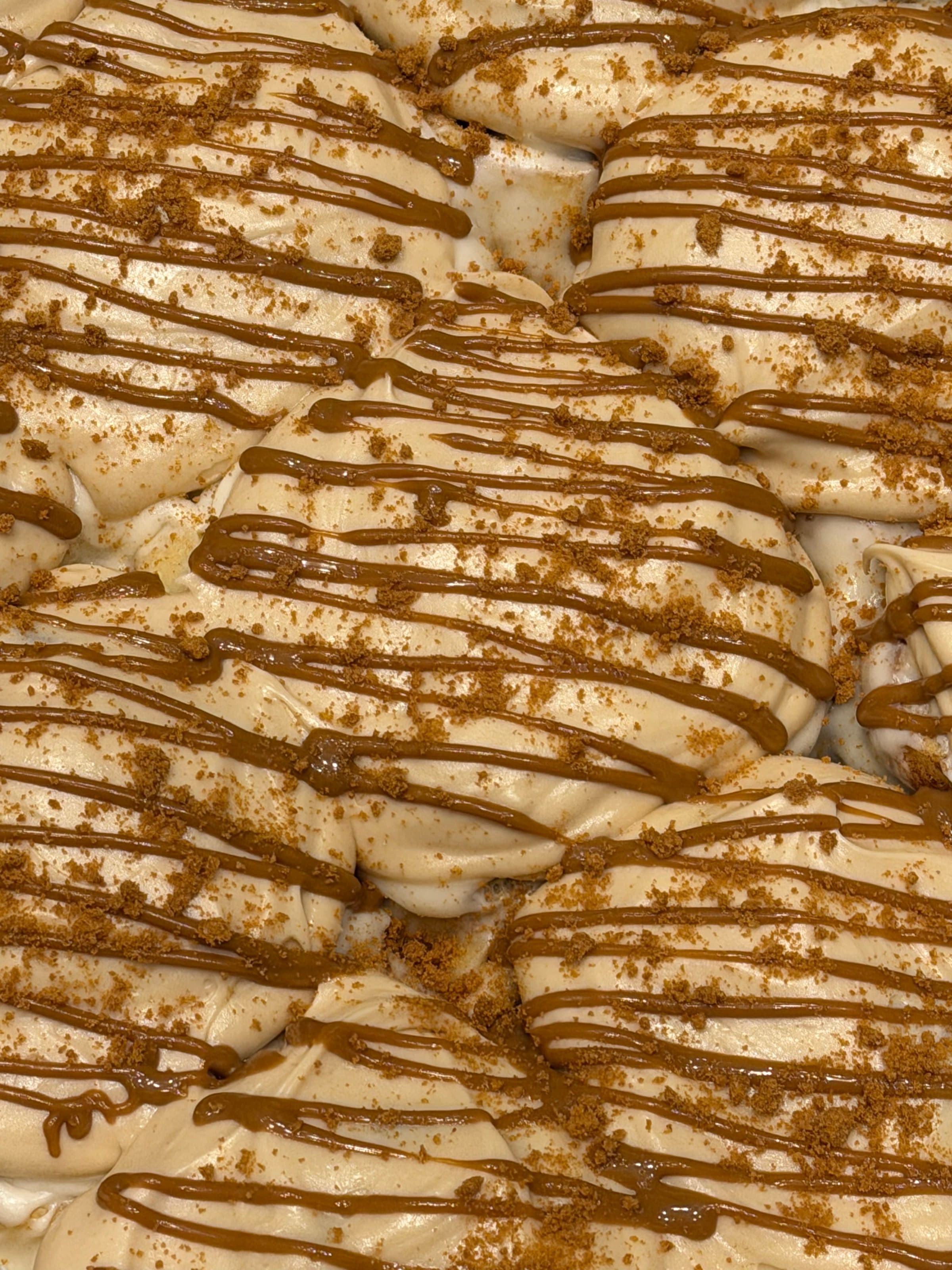 Berloom cinnamon rolls under a Biscoff drizzle