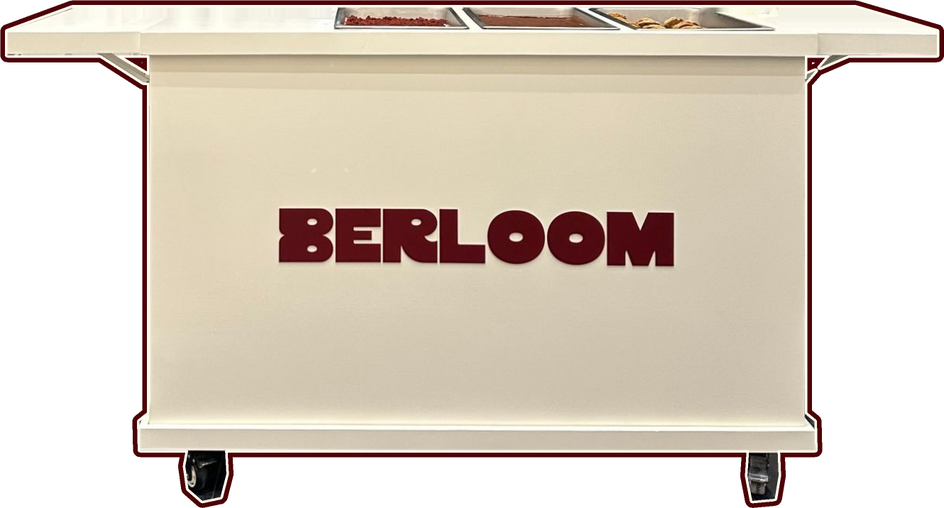 The Berloom catering cart, with trays of dessert set out on top